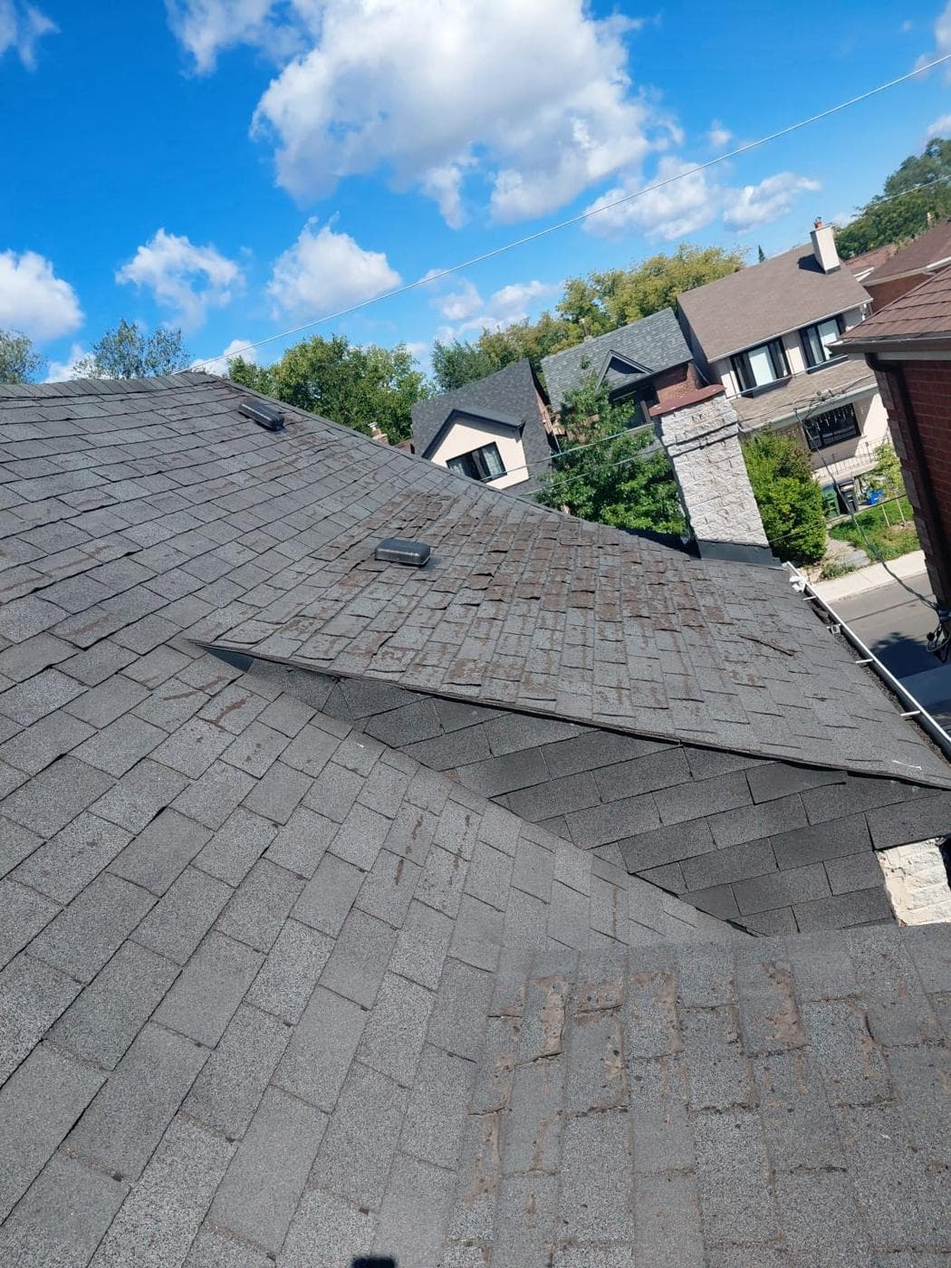 Worn, curling shingles before replacement